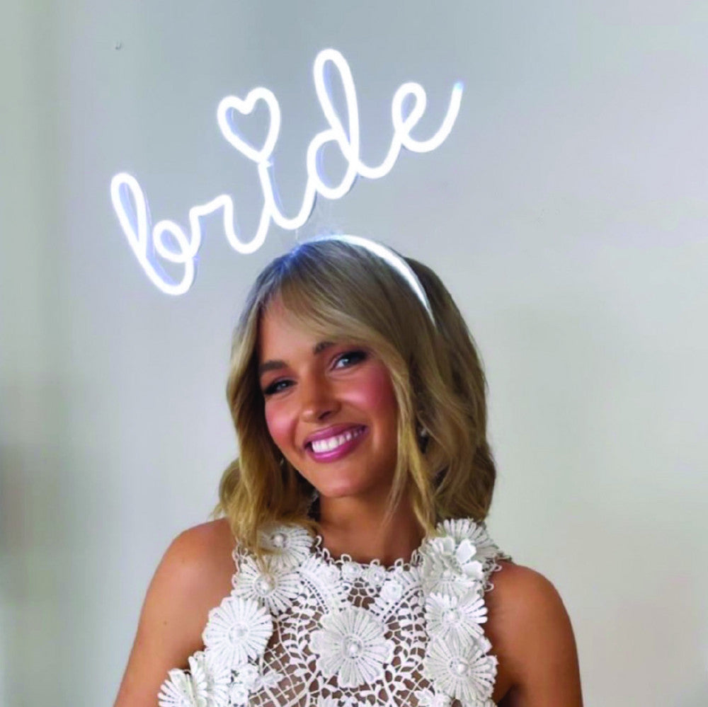 Bride LED neon headband in white. Lights up with a supplied battery pack and can be customised.